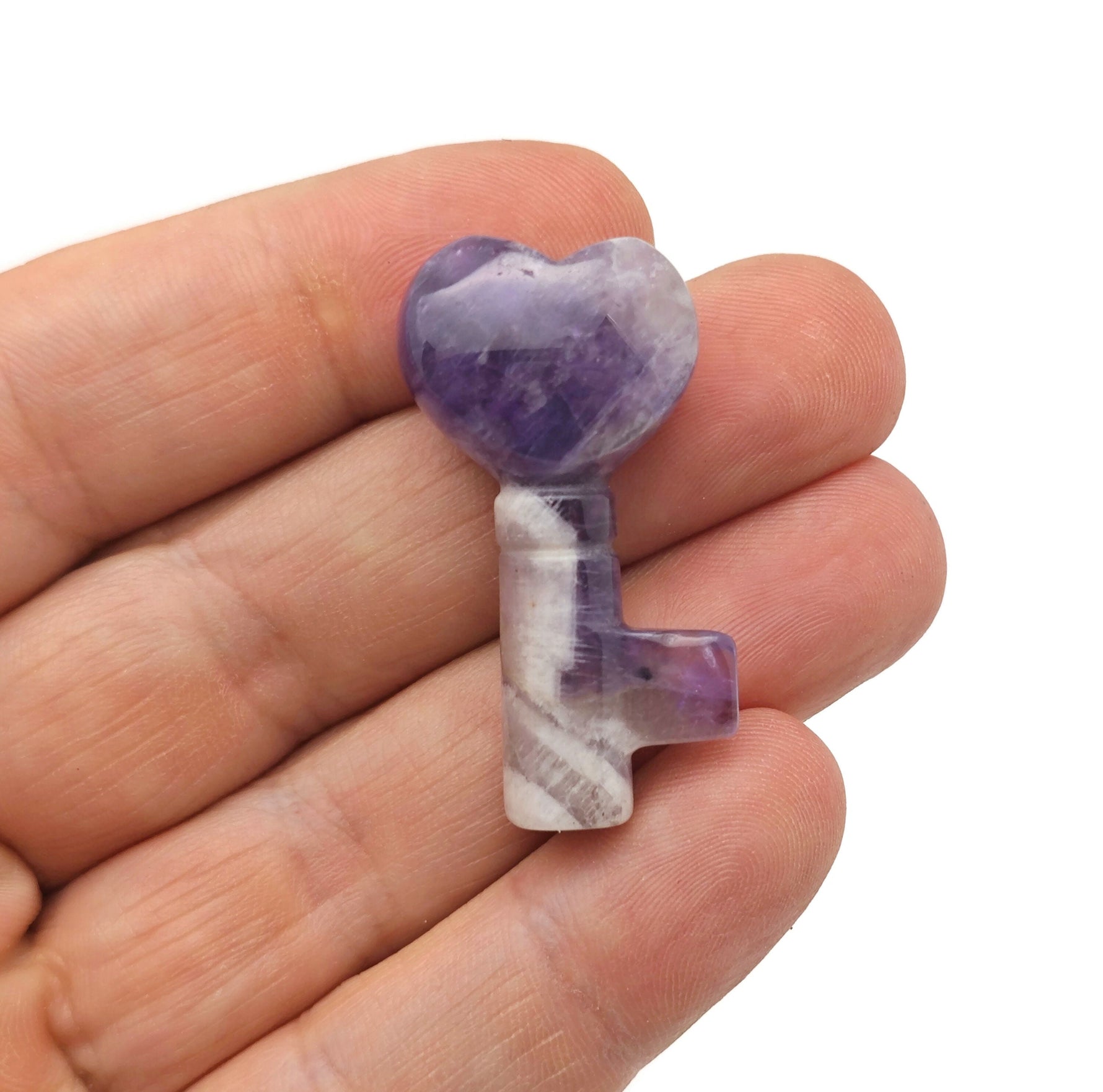 Amethyst key gemstone carving, 40mm, from GemstoneGO, showing detailed purple amethyst with carved key design.