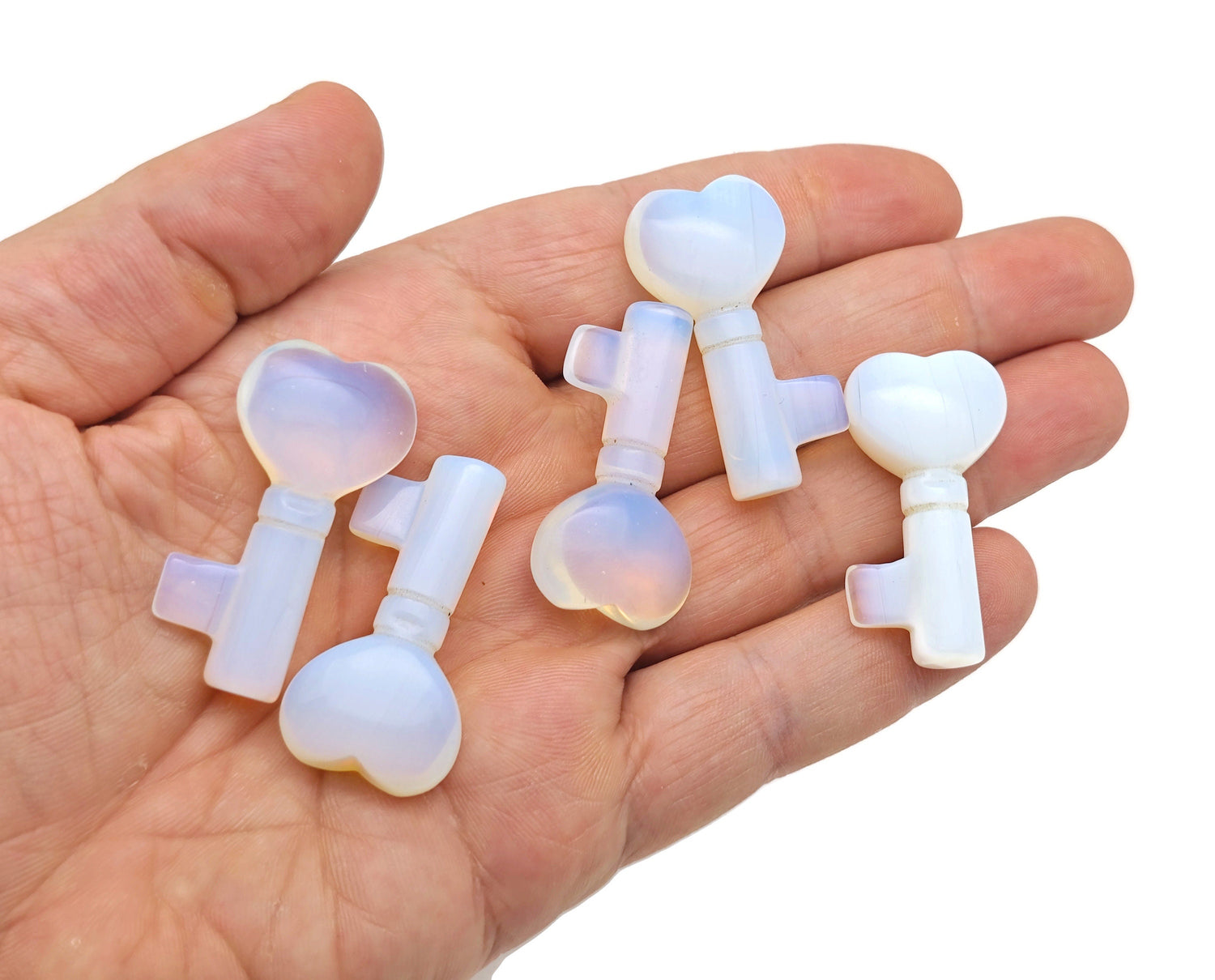 Opalite gemstone key carving, 40mm size, detailed gemstone sculpture from GemstoneGO featuring a smooth, polished finish.