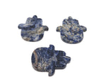 Sodalite evil eye hand gemstone carving by GemstoneGO, detailed blue and white stone sculpture with protective evil eye design