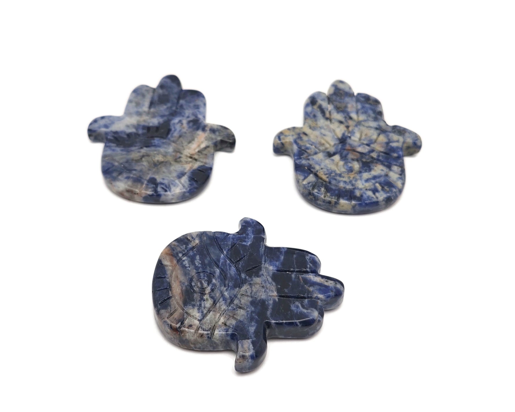 Sodalite evil eye hand gemstone carving by GemstoneGO, detailed blue and white stone sculpture with protective evil eye design
