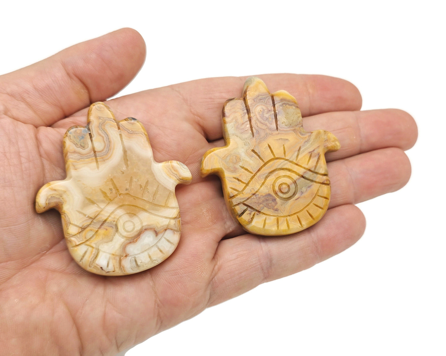 Hand-carved Crazy Lace Agate evil eye gemstone pendant from GemstoneGO, featuring intricate gemstone craftsmanship and vibrant colors.