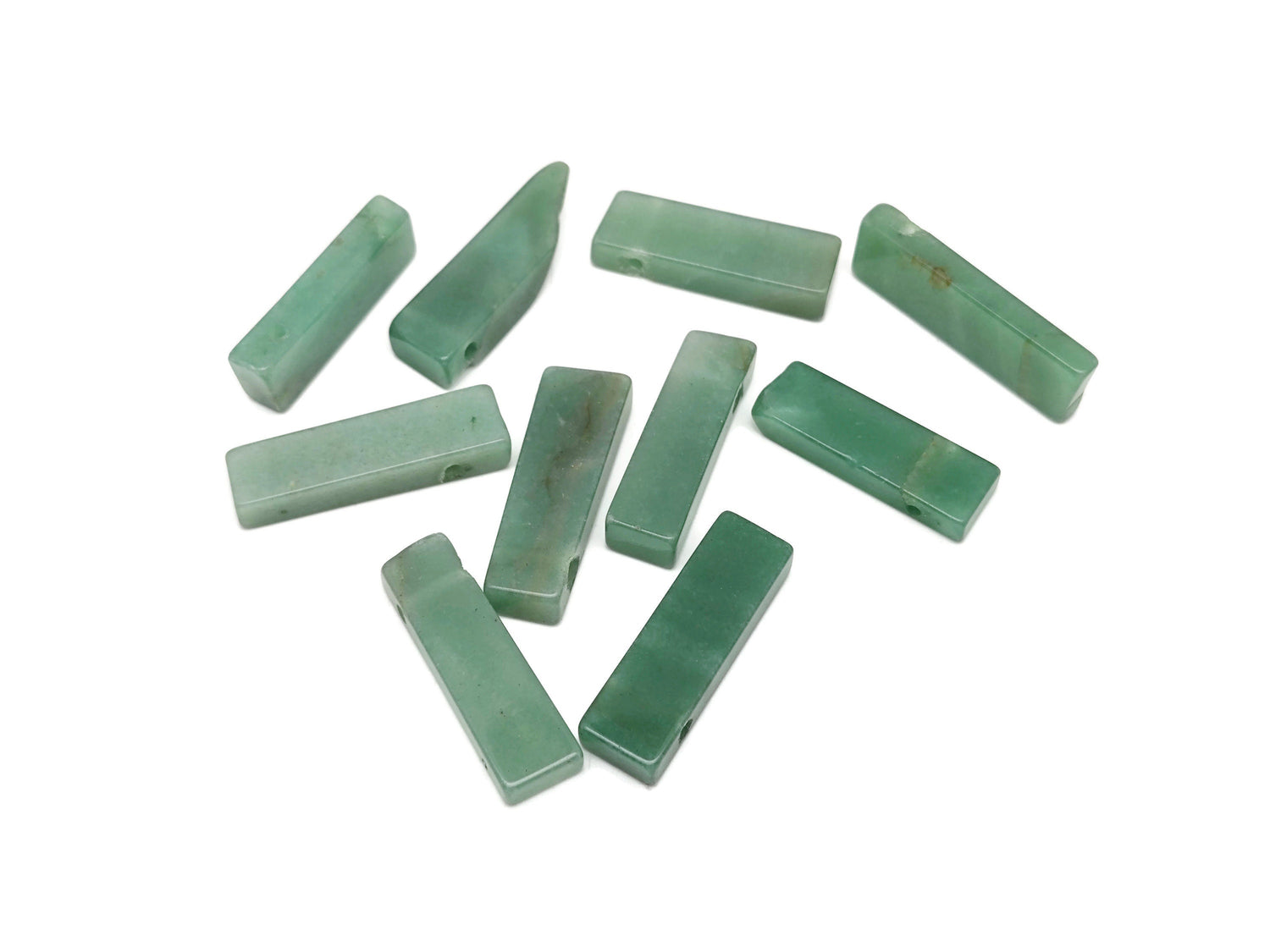 Aventurine drilled tumbled gemstone pendant from GemstoneGO, showcasing a smooth green stone with drilled hole for jewelry.