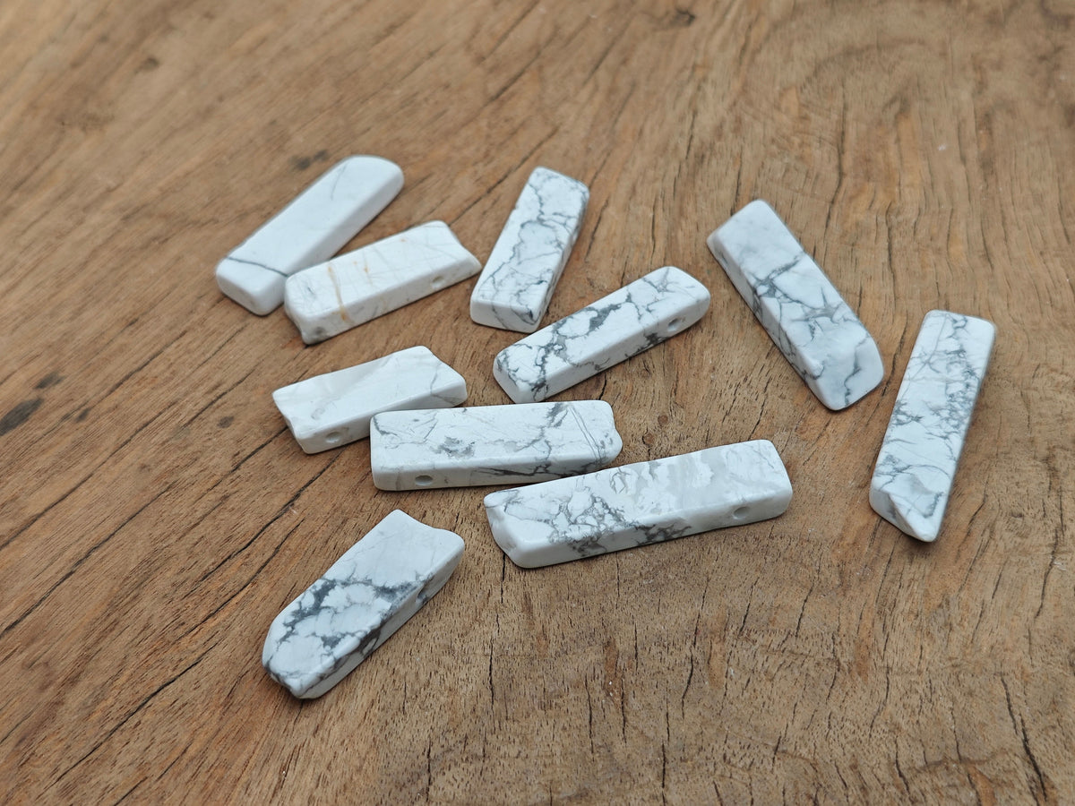Howlite drilled tumbled gemstone pendant from GemstoneGO, smooth white stone with natural veining and hole for jewelry making