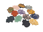 Evil eye hand gemstone carving, pocket crystal for meditation and chakra healing, made of colorful mixed crystals.