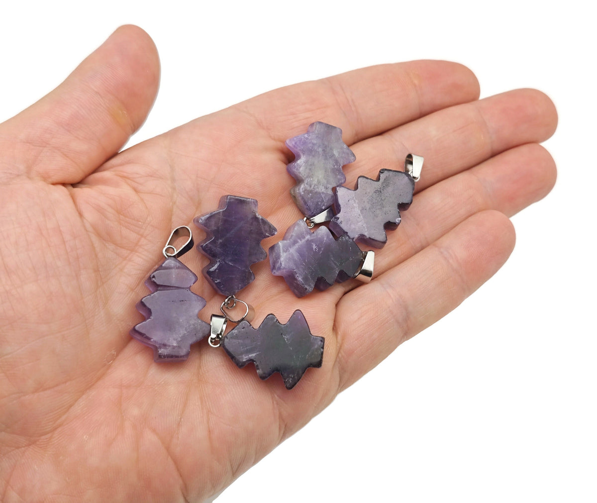Mini amethyst gemstone pine tree pendant by GemstoneGO featuring a detailed crystal design on a silver chain