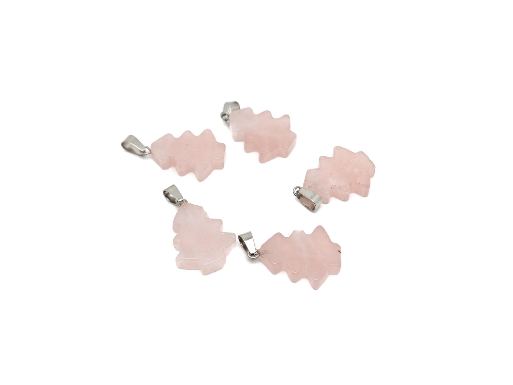 Mini rose quartz gemstone pine tree pendant by GemstoneGO, featuring a delicate crystal design on a silver chain.