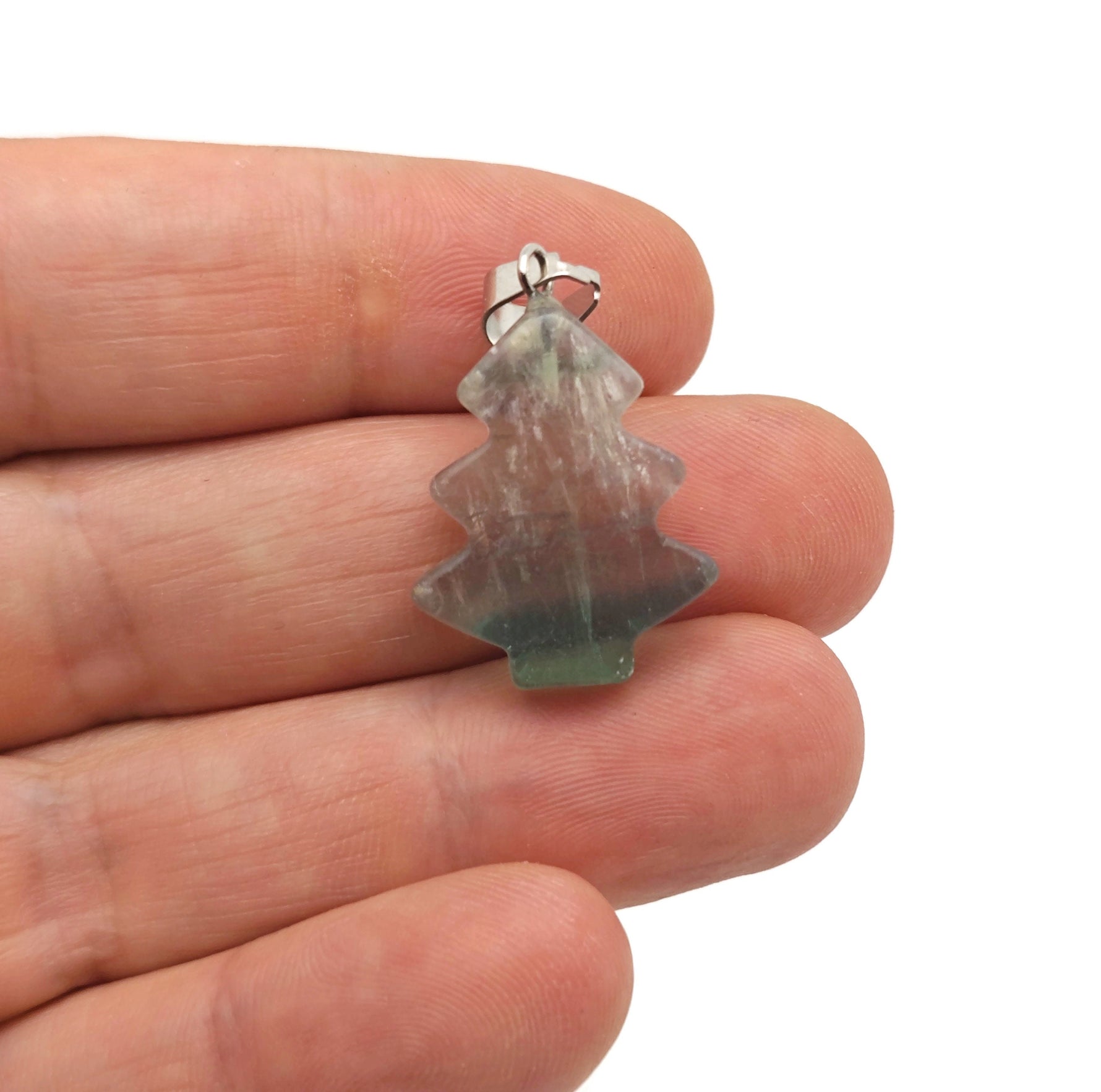 Mini fluorite gemstone pine tree pendant from GemstoneGO featuring vibrant green and purple crystal details.