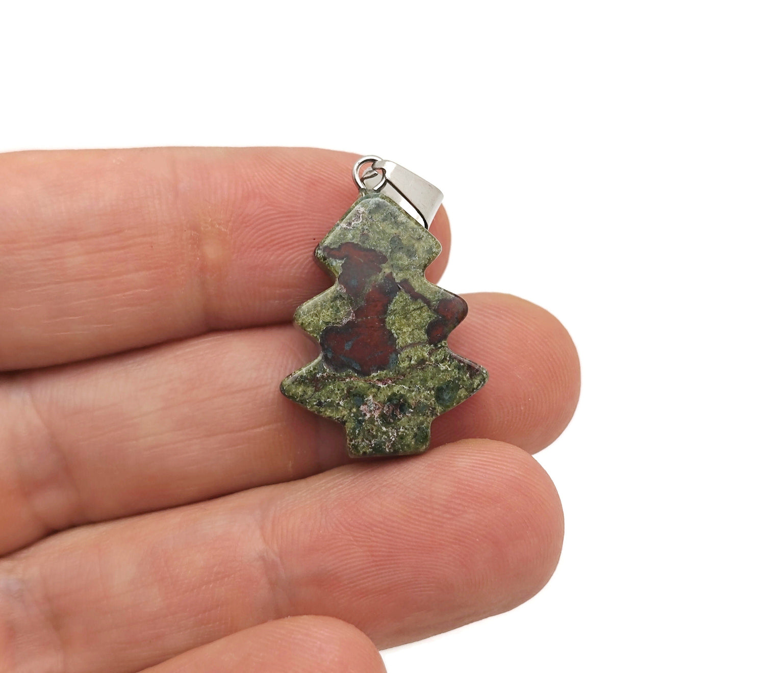 Mini Dragon Blood Jasper gemstone pendant featuring a pine tree design, crafted by GemstoneGO, showcasing rich red and brown tones.