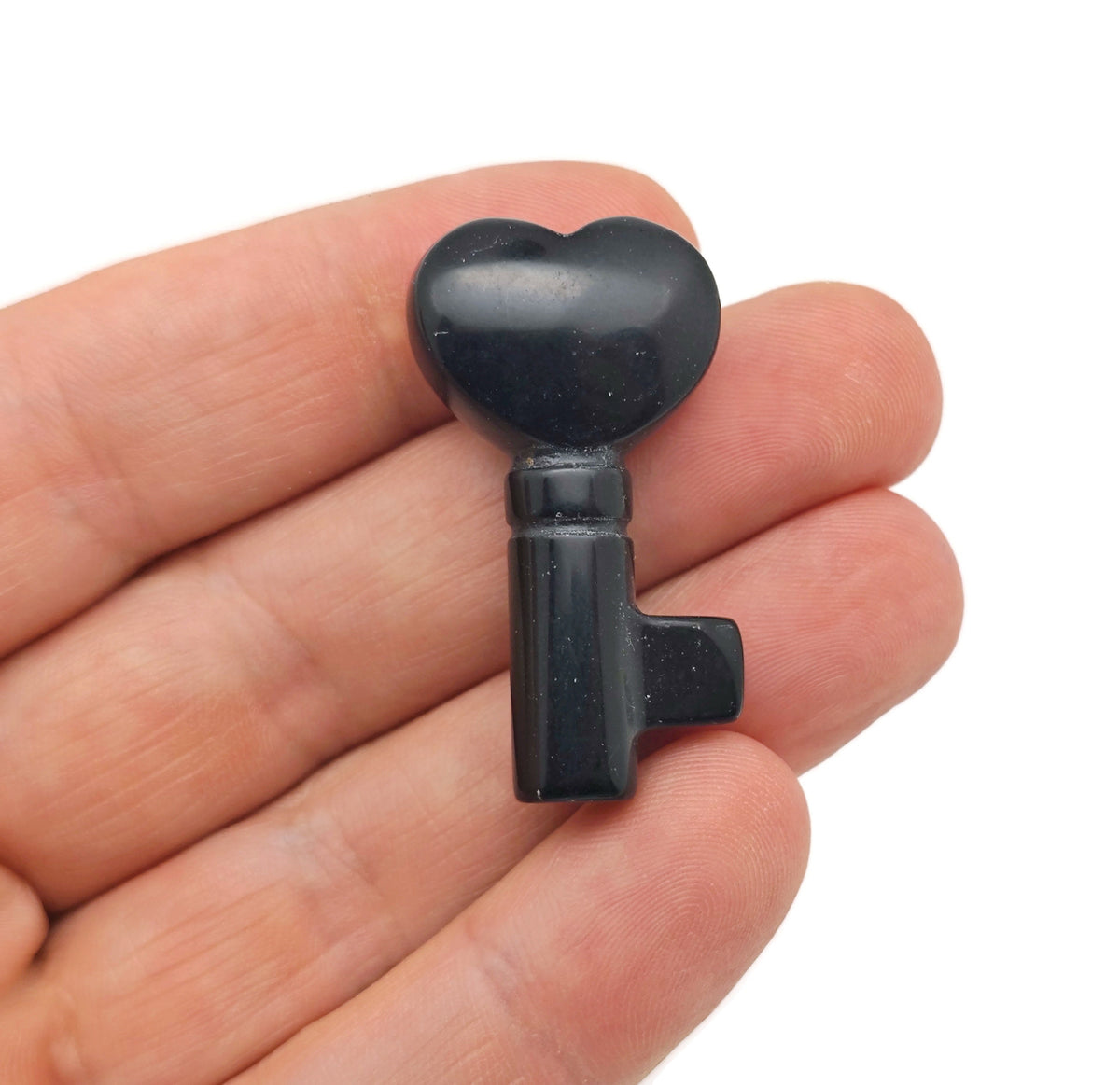 Obsidian key-shaped gemstone carving, 40mm, from GemstoneGO, showing detailed polished black obsidian with intricate carving.