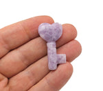 Lepidolite key gemstone carving, 40mm, by GemstoneGO, with purple and gray mineral details visible in the image.