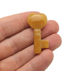 Yellow jade key gemstone carving, 40mm, from GemstoneGO, showcasing detailed craftsmanship and vibrant yellow color.