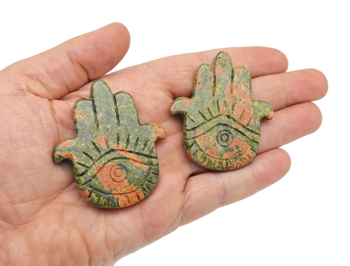 Unakite evil eye hand gemstone carving from GemstoneGO, detailed view of the carved protective talisman.