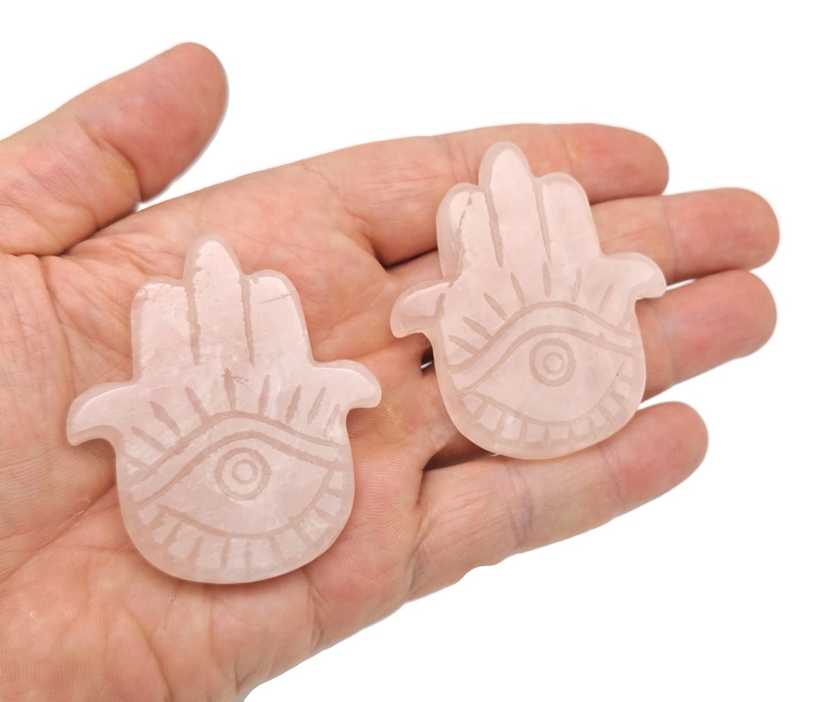 Rose quartz evil eye hand gemstone carving by GemstoneGO, featuring detailed craftsmanship and vibrant pink stone design.