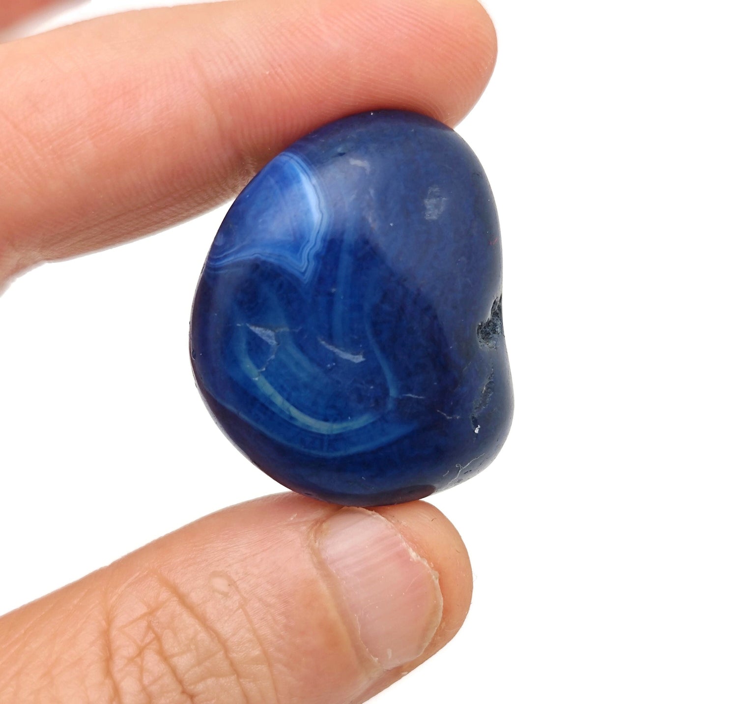 Blue Agate tumbled stone from GemstoneGO, showcasing smooth, polished blue agate with natural banding and vibrant color.