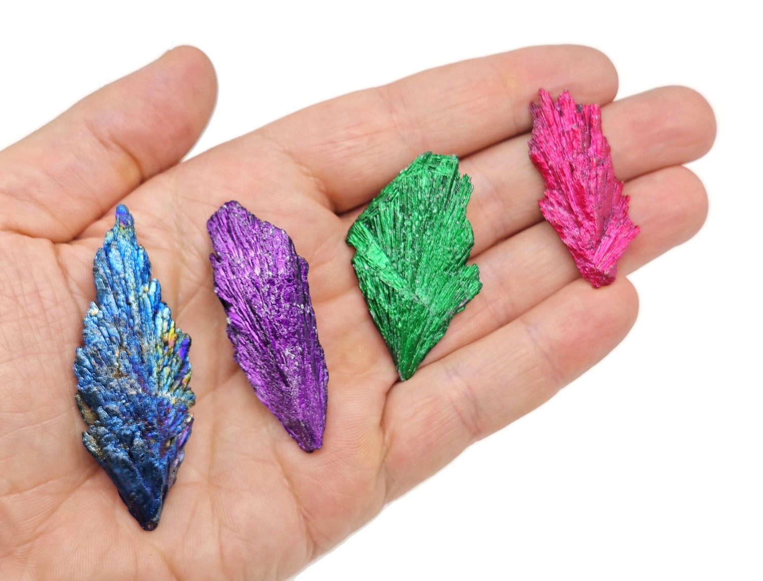 Raw Aura Kyanite fan gemstone in various colors, showcasing natural crystalline structure and vibrant hues from GemstoneGO.
