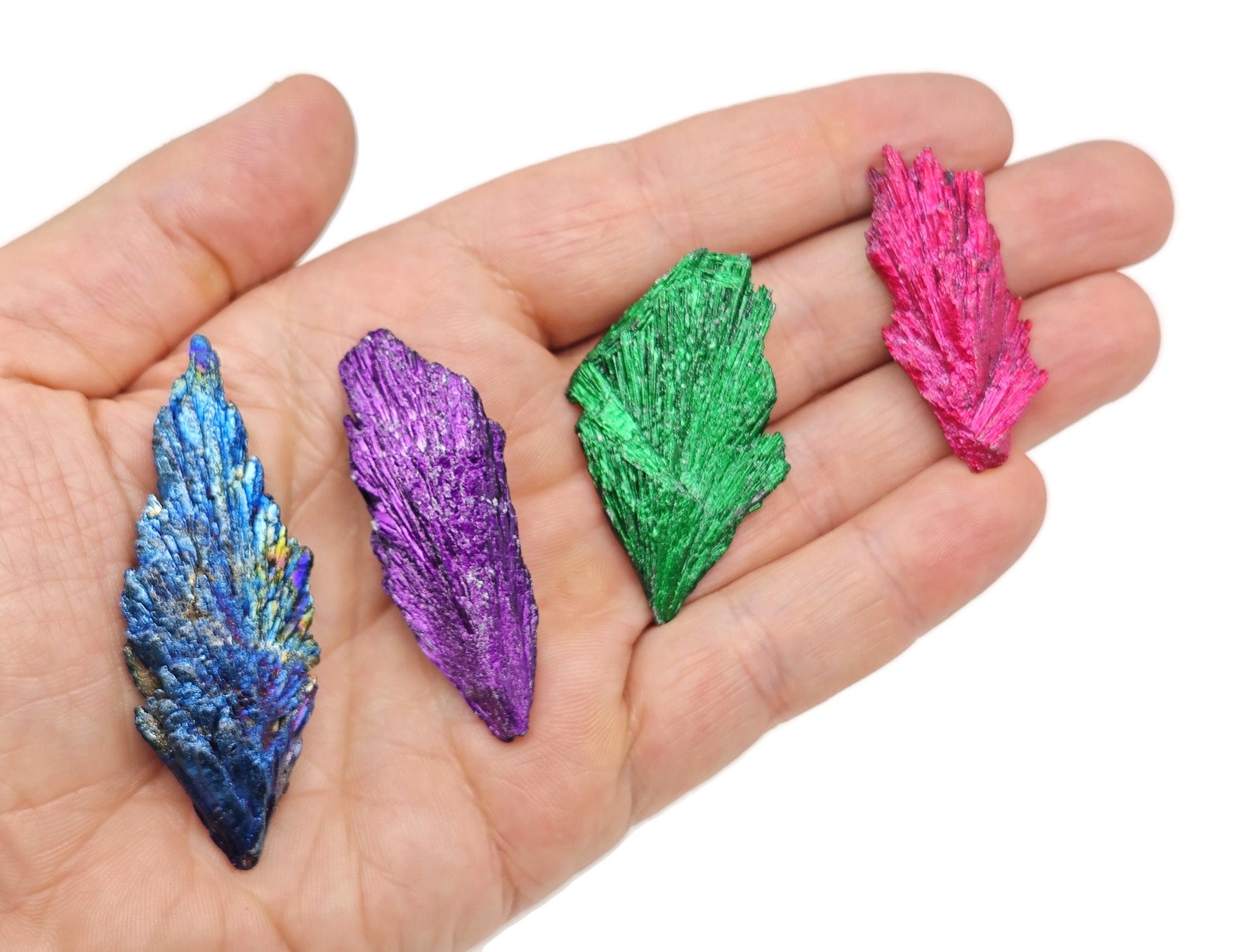 Raw Aura Kyanite fan gemstone in various colors, showcasing natural crystalline structure and vibrant hues from GemstoneGO.