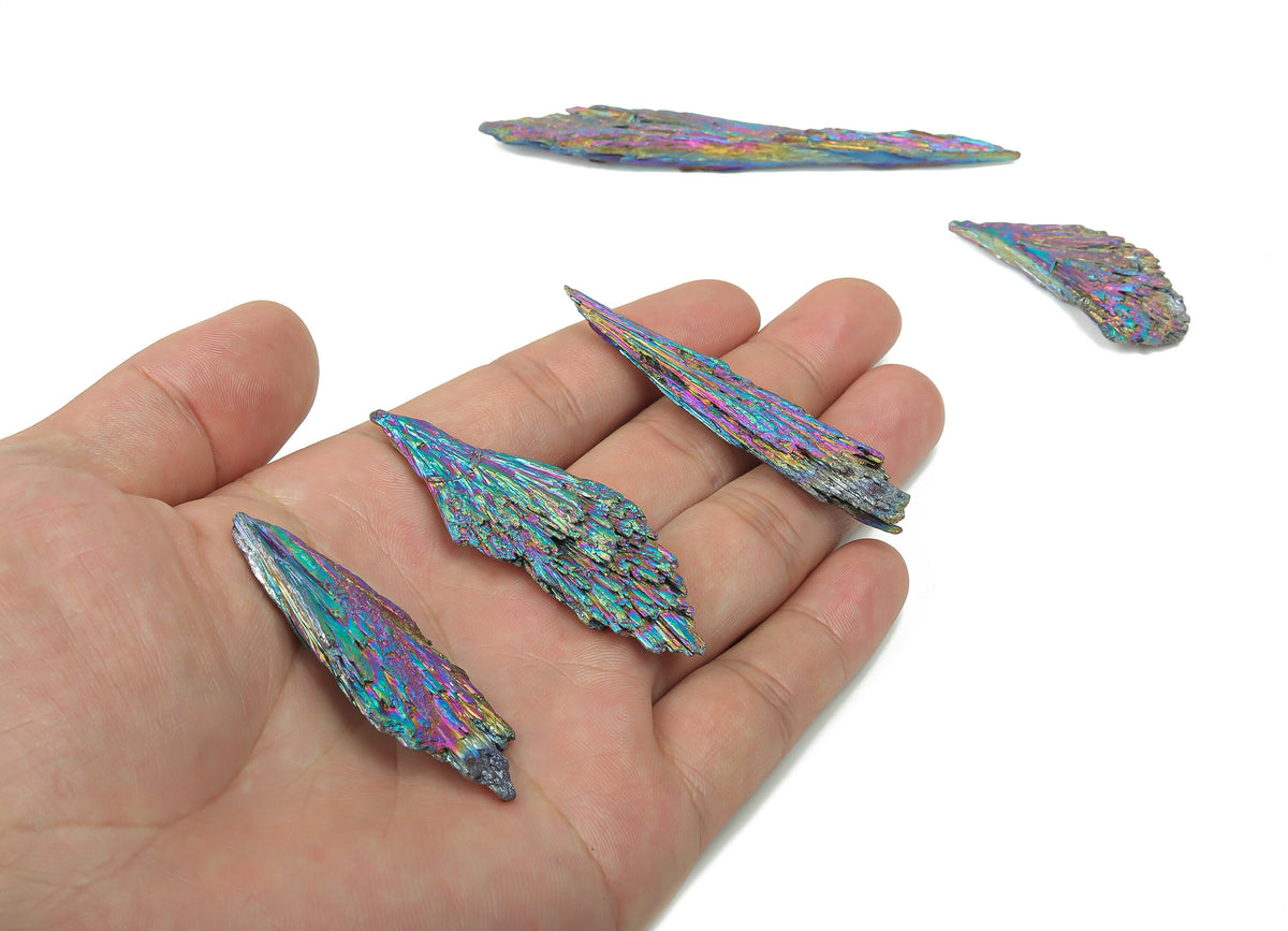 Aura Kyanite Fan gemstone from GemstoneGO, featuring vibrant raw kyanite crystals in various colors arranged as a fan shape.