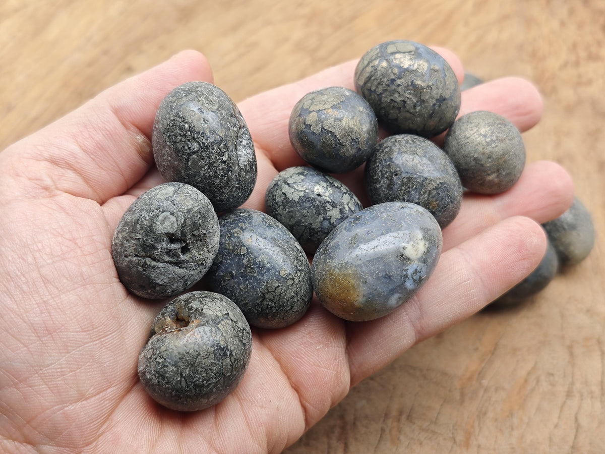 Cooper Agate tumbled stone from GemstoneGO showing polished, smooth gemstone with rich orange and brown tones.