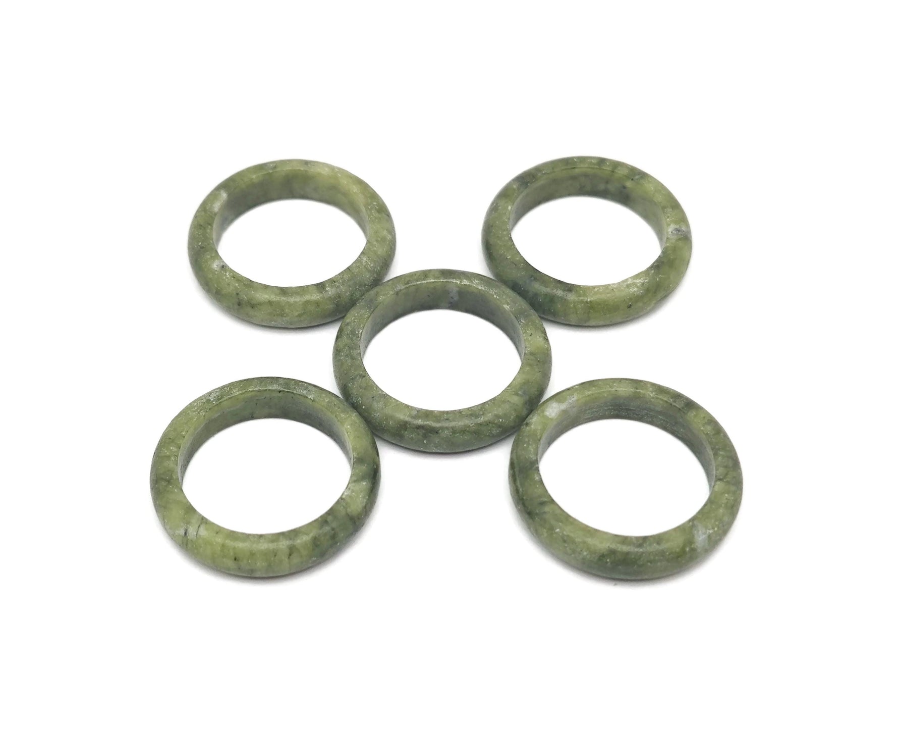 Nephrite jade crystal ring from GemstoneGO featuring a polished green jade stone set in a silver band.