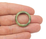 Nephrite jade crystal ring with a polished band, featuring a smooth green gemstone, from GemstoneGO's jewelry collection.