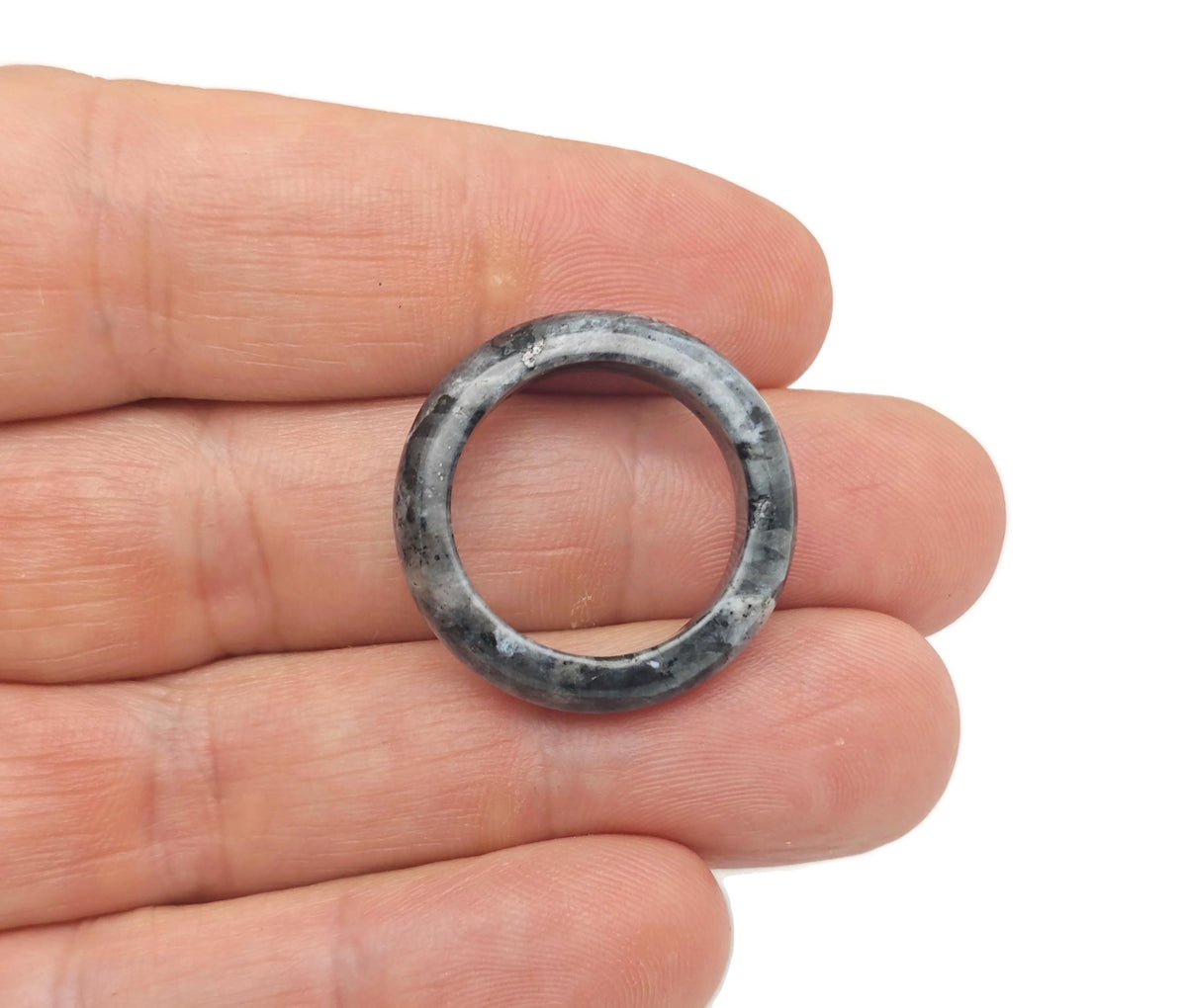 Larvikite crystal ring by GemstoneGO showcasing a polished oval larvikite gemstone set in a silver band.