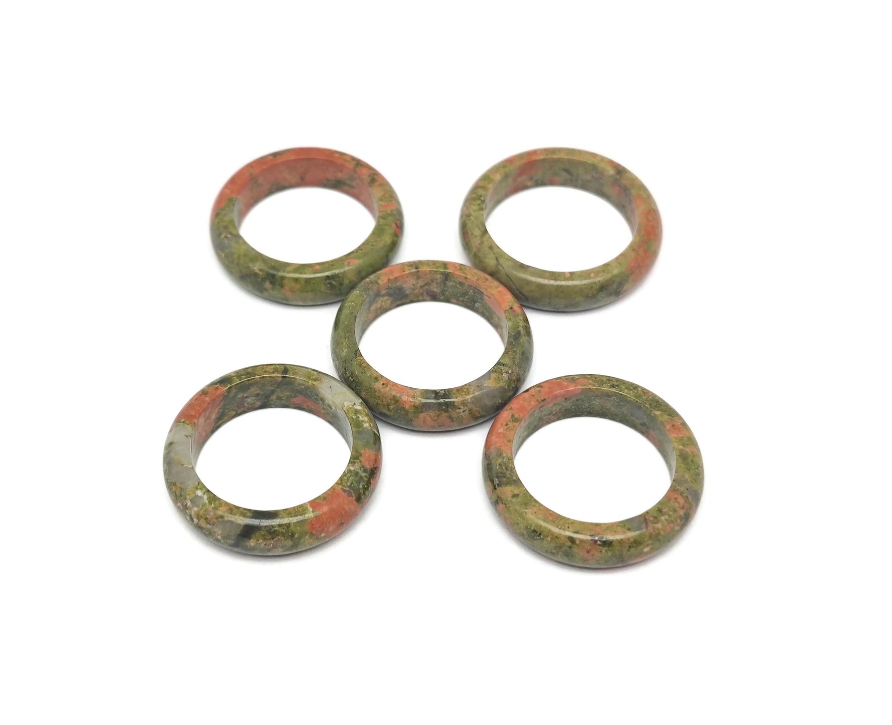 Unakite crystal ring by GemstoneGO featuring a vibrant green and pink gemstone set in a silver band.
