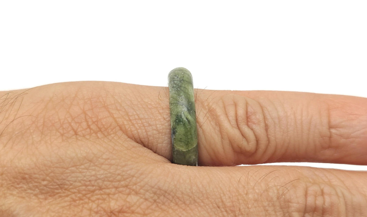 Nephrite jade crystal ring by GemstoneGO featuring a polished green jade stone set in a silver band.