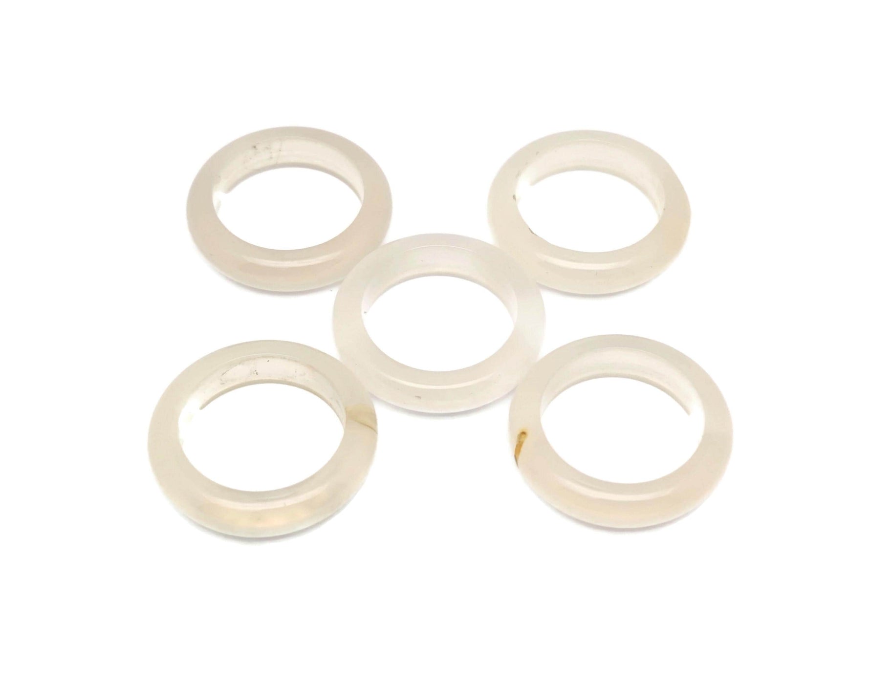 White Agate crystal ring by GemstoneGO featuring a polished white agate stone set in a sleek metal band.