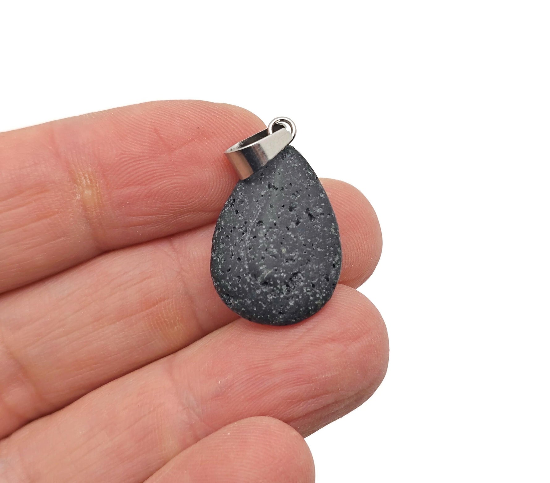 Lava crystal pendant featuring a spiritual stone from GemstoneGO, showcasing a dark porous volcanic rock pendant on a necklace chain.