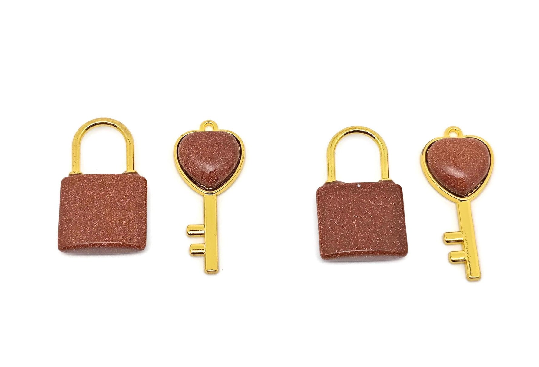 Goldstone Heart Key Crystal Pendant by GemstoneGO featuring a goldstone heart-shaped charm with a key design and sparkling crystal details.