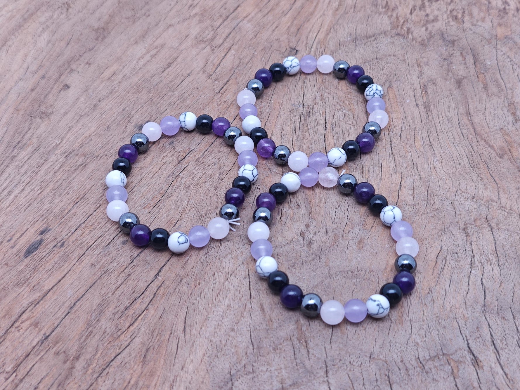 Handmade Calming Gemstone Bracelet by GemstoneGO featuring smooth, colorful gemstone beads on an elastic band.