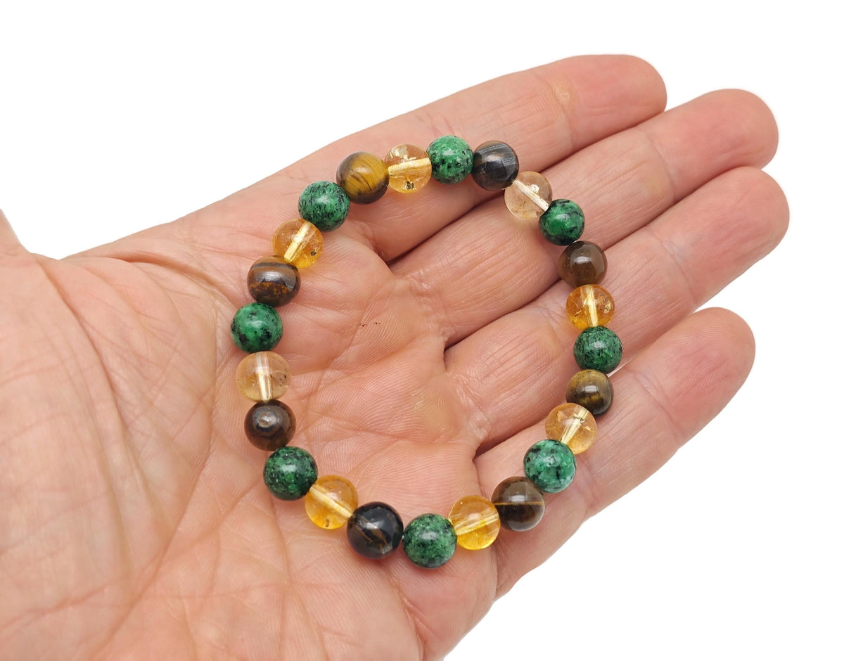Handmade gemstone bracelet with colorful beads, designed for abundance and prosperity, featuring natural stone accents.