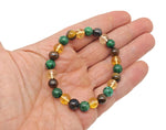 Handmade gemstone bracelet with colorful beads, designed for abundance and prosperity, featuring natural stone accents.