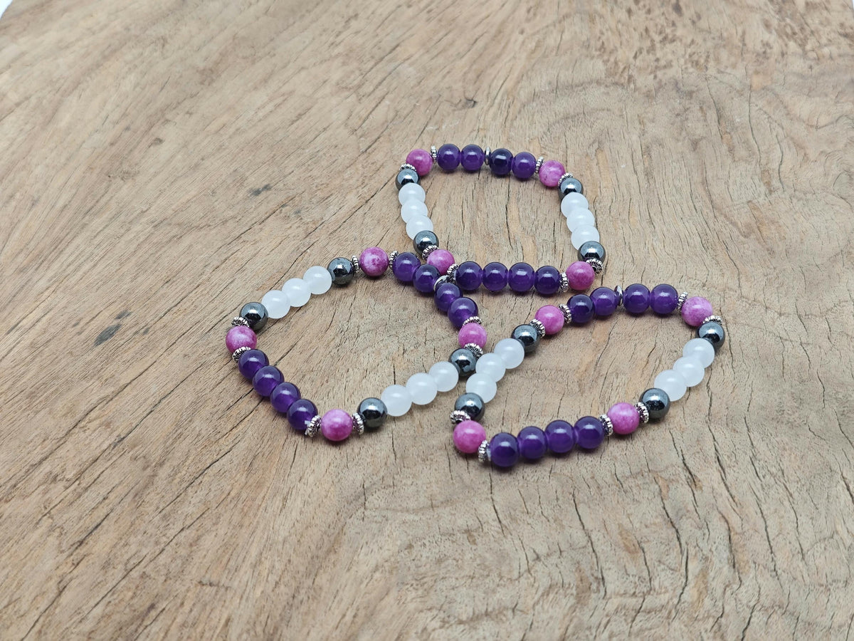 Handmade gemstone sleep bracelet with colorful beads and adjustable cord, designed for relaxation and positive intentions.