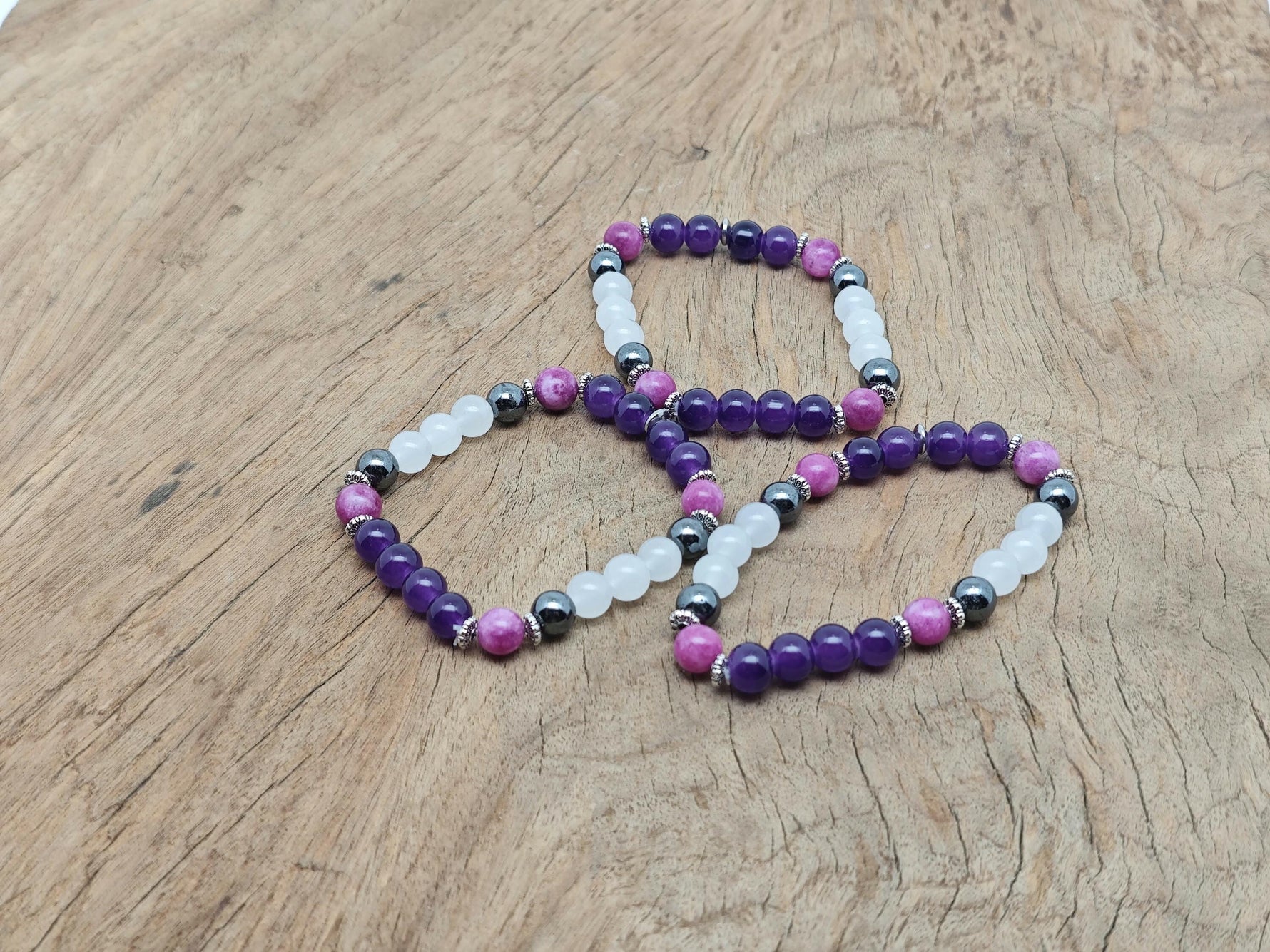 Handmade gemstone sleep bracelet with colorful beads and adjustable cord, designed for relaxation and positive intentions.