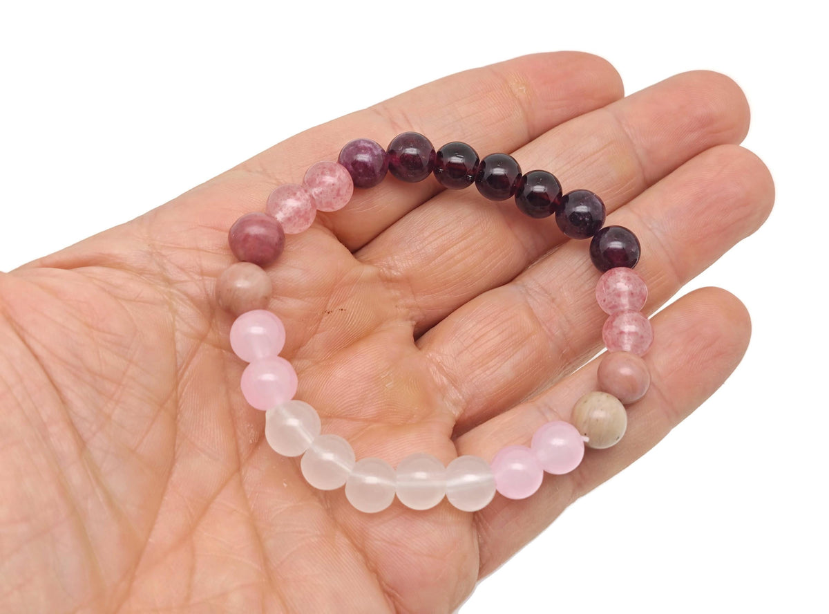 Handmade gemstone bracelet with colorful beads and charms, designed as an intention bracelet by GemstoneGO.