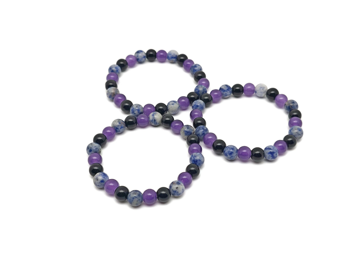 Handmade gemstone intention bracelet with smooth beads in calming colors, designed for soothing and positive energy.