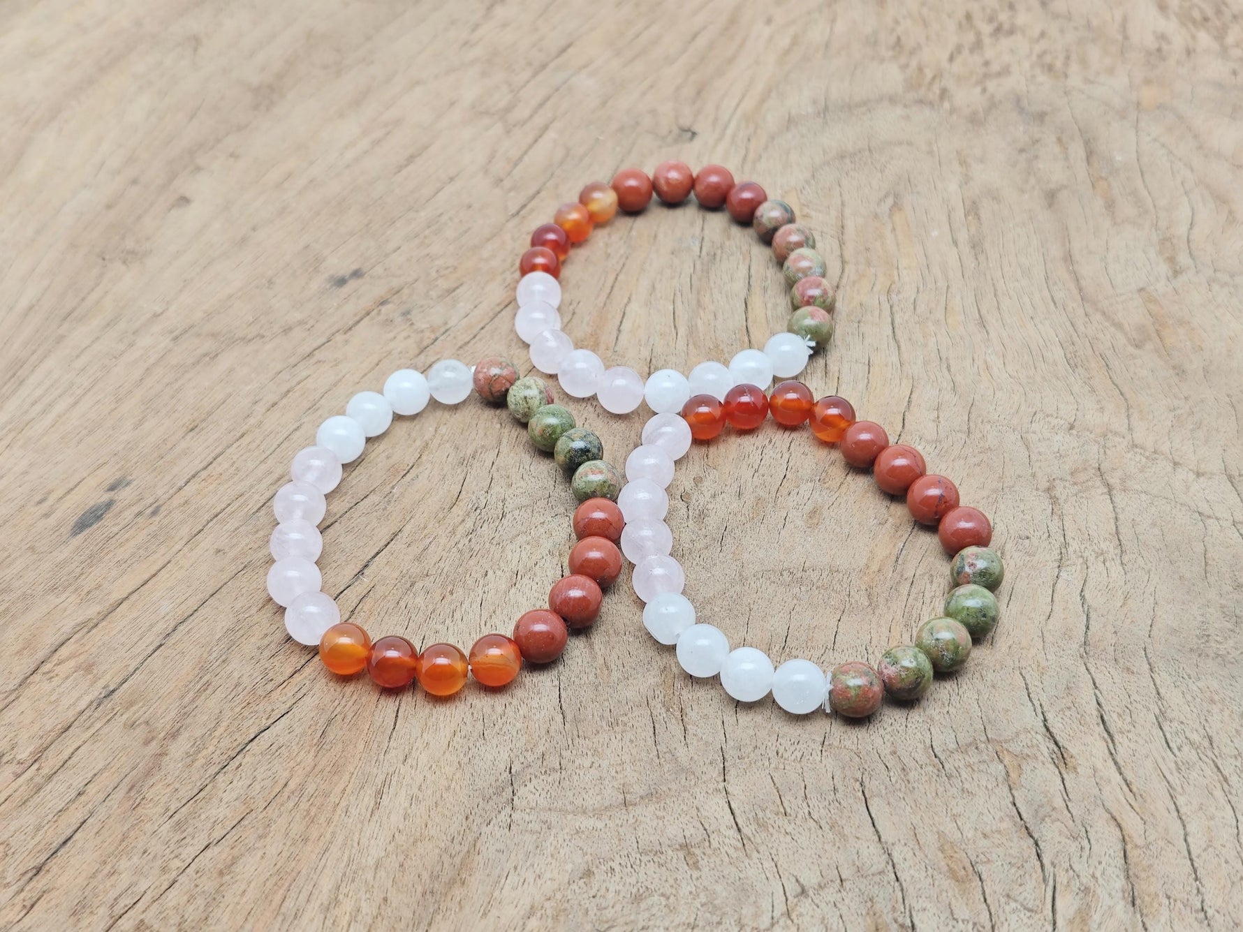 Handmade fertility gemstone bracelet with colorful beads and adjustable cord, designed for intention and positive energy.