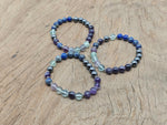 Handmade gemstone memory bracelet with colorful beads and charm, designed for intention and personal meaning, by GemstoneGO.