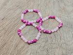 Handmade Love Gemstone Bracelet by GemstoneGO featuring colorful beads and a charm, perfect for expressing love and intention.