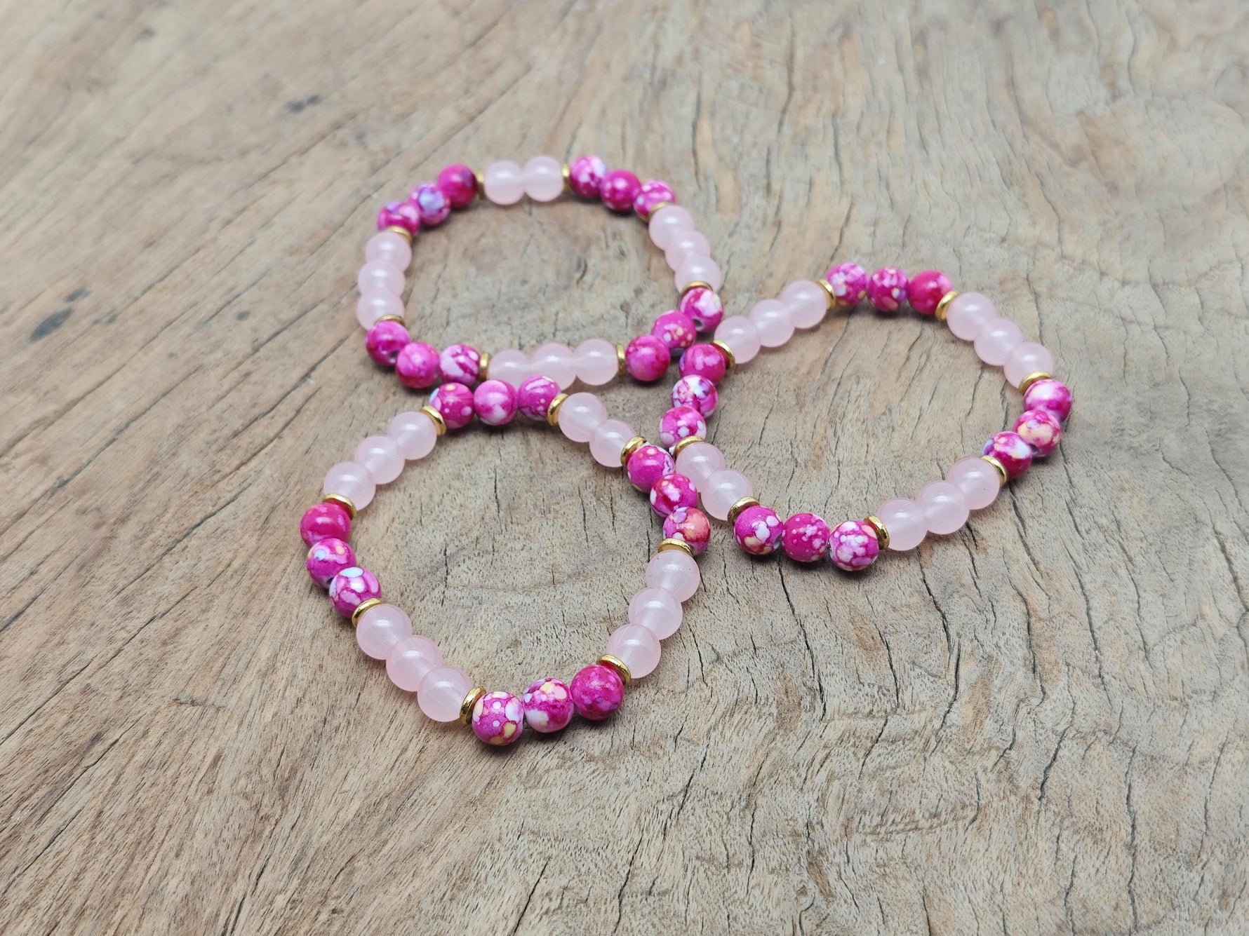 Handmade Love Gemstone Bracelet by GemstoneGO featuring colorful beads and a charm, perfect for expressing love and intention.