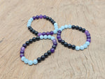 Handmade gemstone bracelet with colorful stones, designed for pain relief and positive intentions by GemstoneGO.