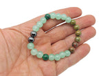 Handmade Promete gemstone bracelet by GemstoneGO featuring colorful stones on an elastic band, designed as an intention bracelet.