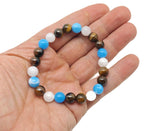 Handmade gemstone bracelet with colorful beads and charm, designed as an intention bracelet by GemstoneGO.