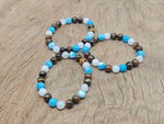 Handmade gemstone bracelet with colorful beads, featuring a Happy Gemstone design from GemstoneGO, perfect for intention and style.