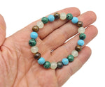 Handmade crystal healing gemstone bracelet with colorful beads, designed for positive intentions, by GemstoneGO.