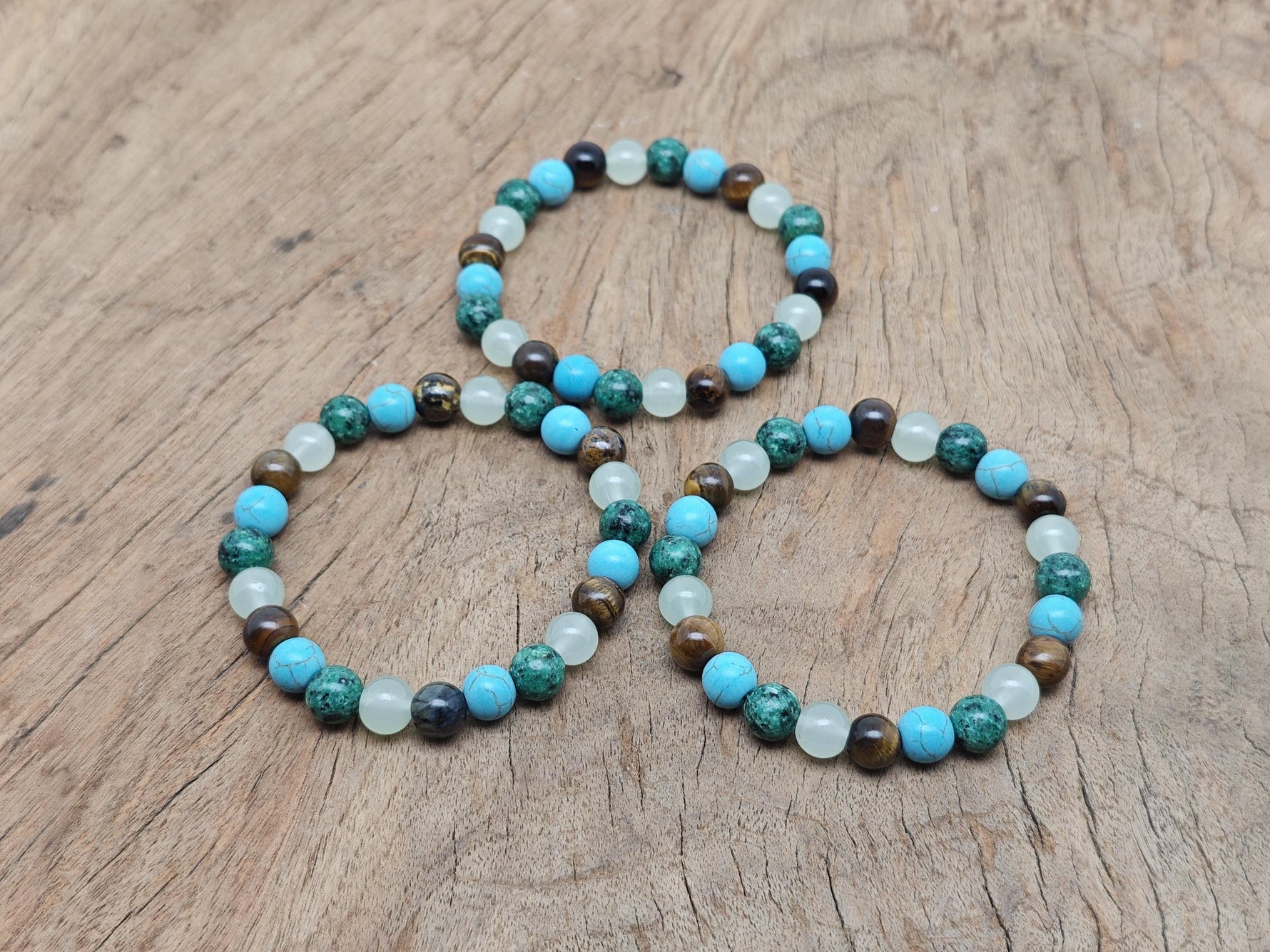 Handmade crystal healing gemstone bracelet with colorful beads and adjustable cord, designed for intention and positive energy.