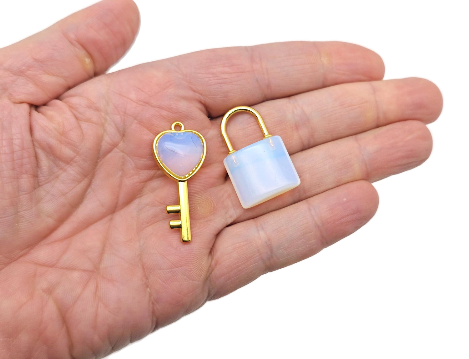 Opalite heart-shaped crystal pendant from GemstoneGO, featuring a smooth, polished opalite stone with a silver-tone bail.