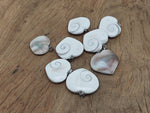 Shiva Shell heart-shaped gemstone pendant from GemstoneGO featuring a polished natural shell heart design.