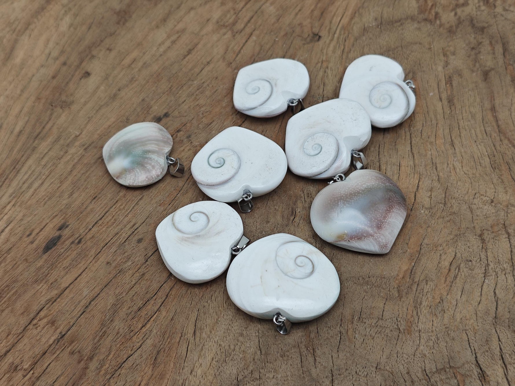 Shiva Shell heart-shaped gemstone pendant from GemstoneGO featuring a polished natural shell heart design.